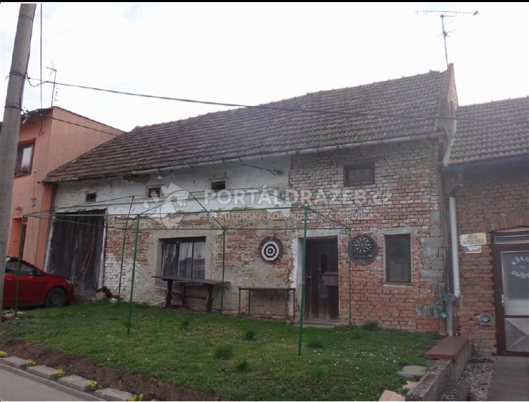 id. 1/2 rodinného domu se zahradou v k.ú.